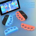 Näppäinkahvat Nintendo Switchin 2 Joy-Con-ohjaimelle – 2 kpl – oranssi / sininen